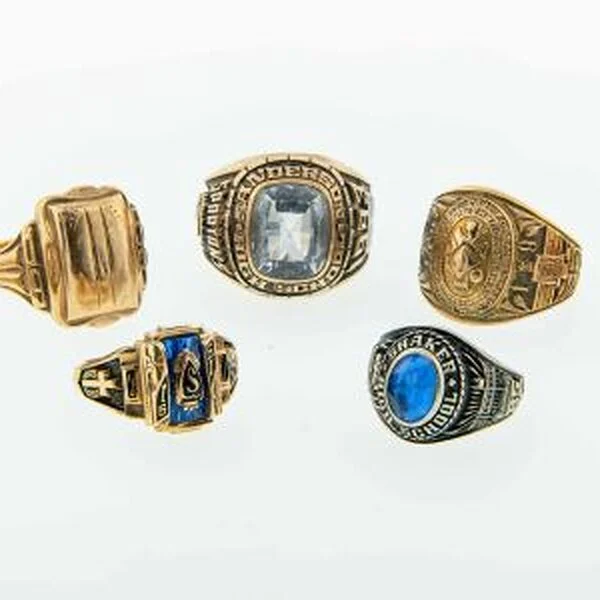 Five gold class rings with coloured stones and engraved sides