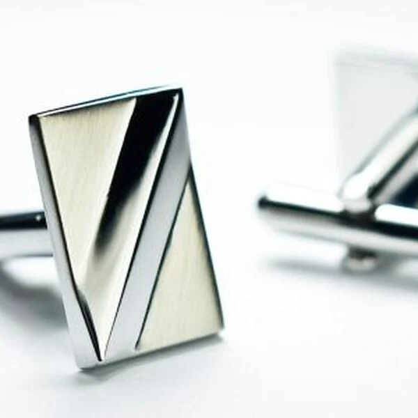 Rectangular silver cufflinks with a diagonal brushed panel