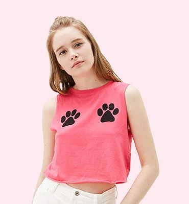 Young woman in a pink tank top with paw prints