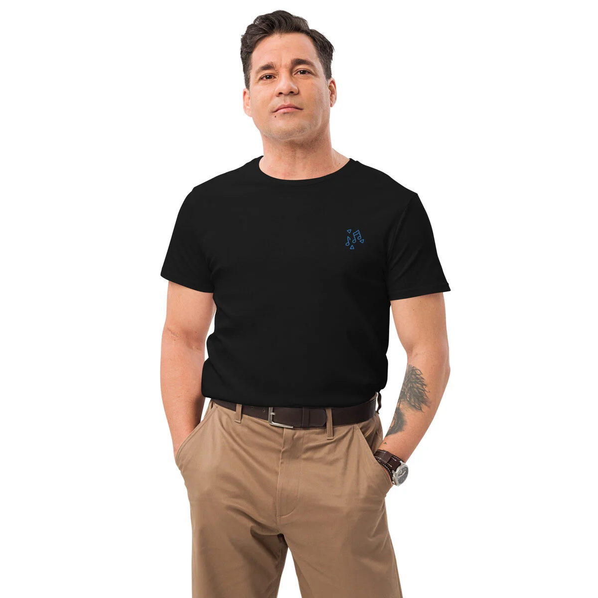 Man in a black premium tee with a small embroidered note