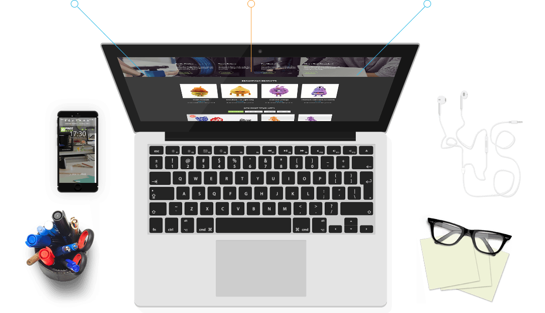 A laptop showing the store with a phone, earphones and glasses around it