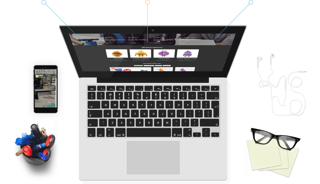 A laptop showing the store with a phone, earphones and glasses around it